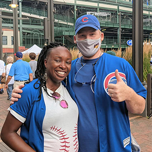 Two Chicago Cubs fans attending an alumni gathering at Wrigley Field