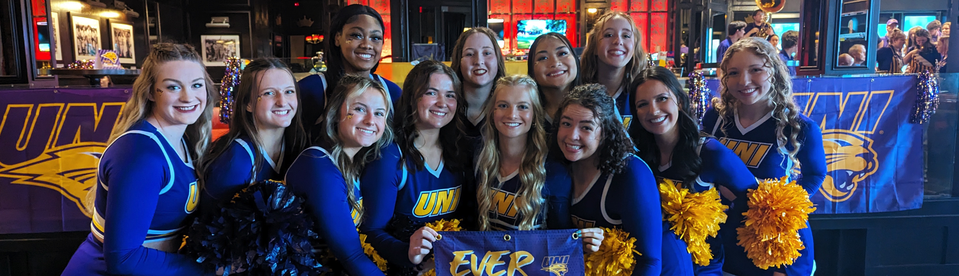 The UNI cheer team at the Arch Madness pregame fan rally