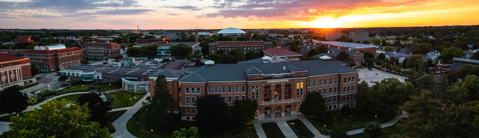 A drone shot of UNI's campus at sunset