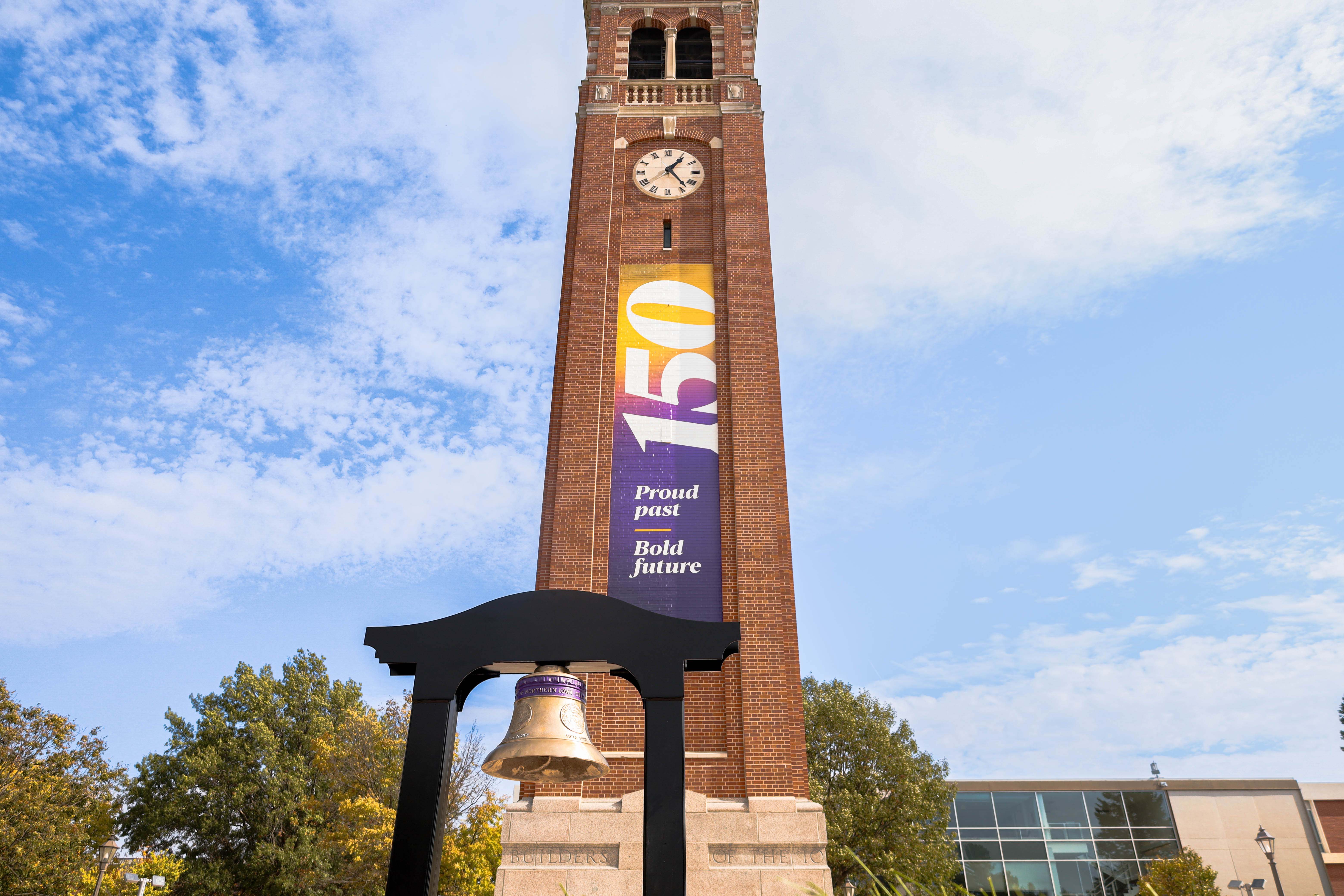 The Campanile with a 150th banner and the Sesquicentennial Bell in front.