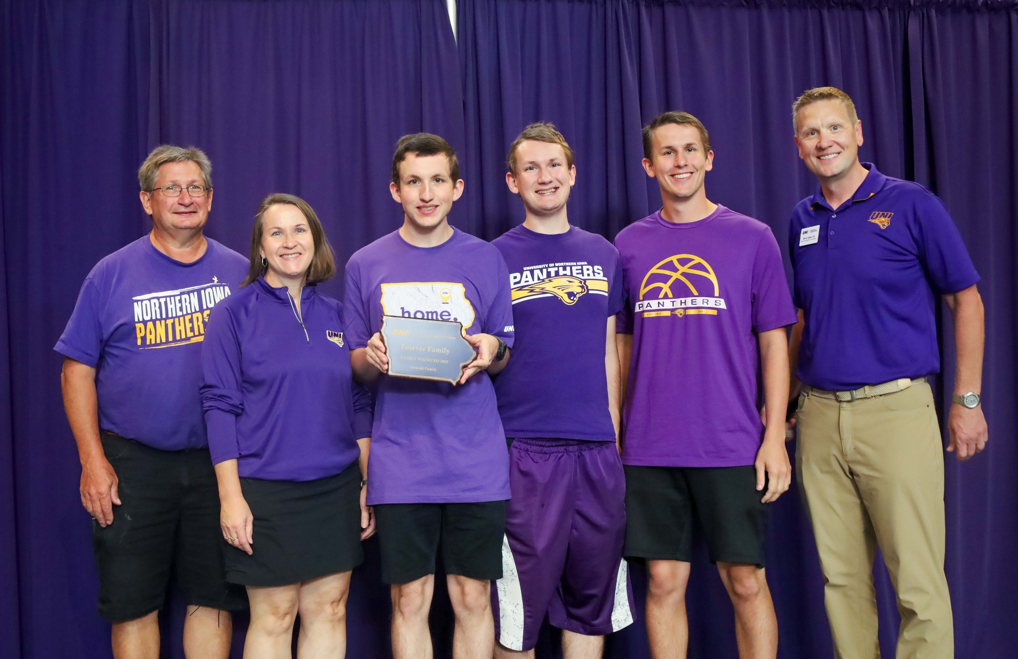 The Peiffer Family holding the Forever Family award.