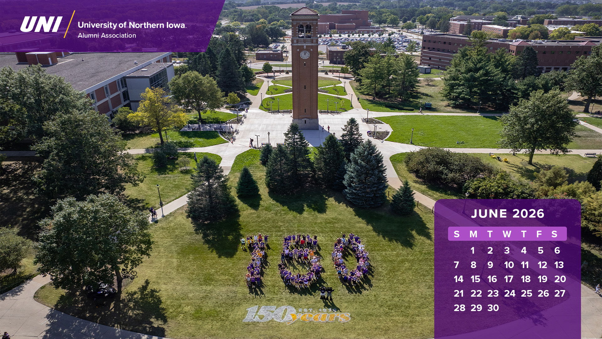 Drone view of people lined up in a 150 shape with calendar graphics.