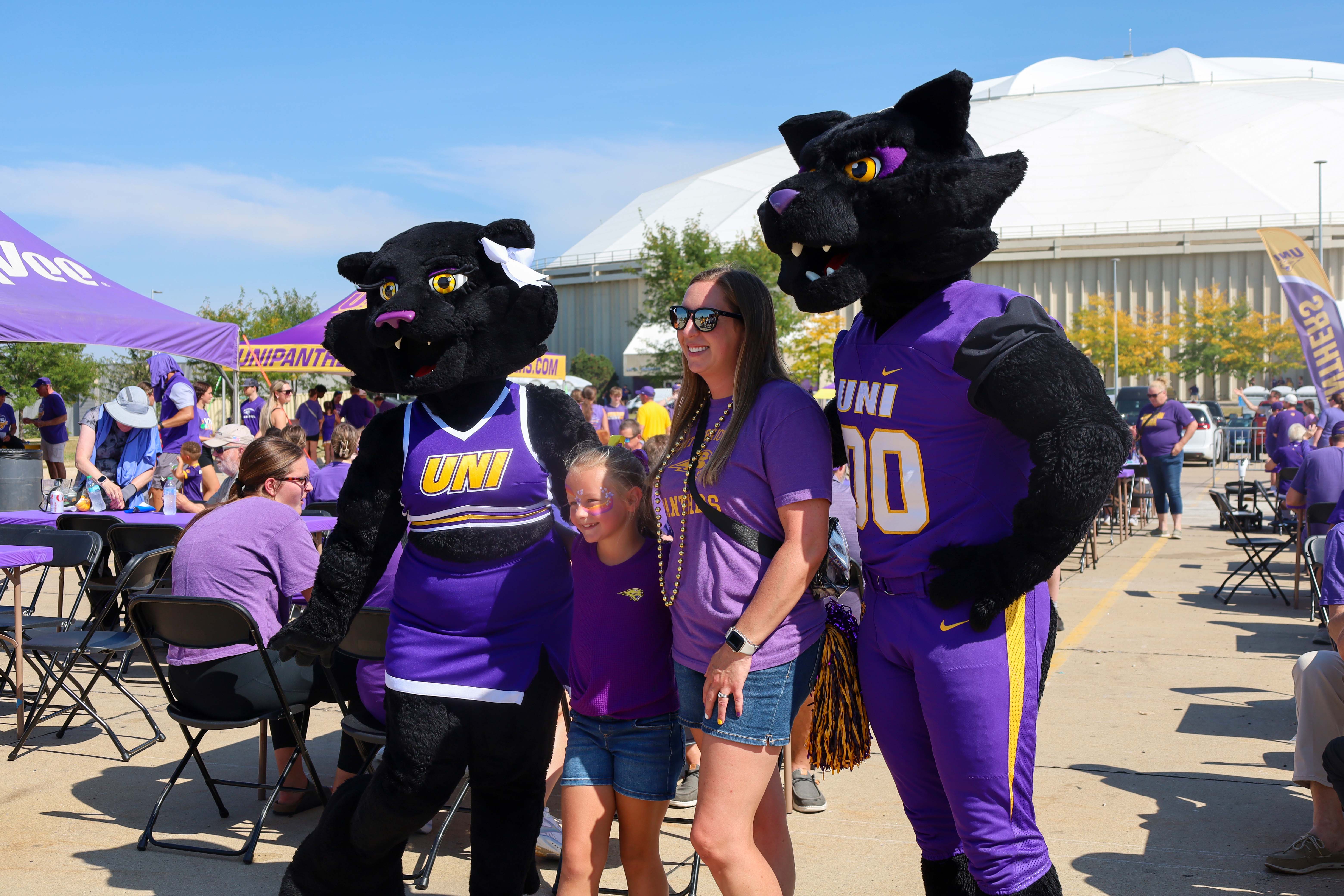 Panther family posing with TC and TK.