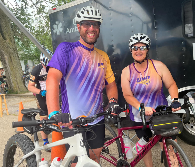 Two UNI alums in bike jerseys on RAGBRAI