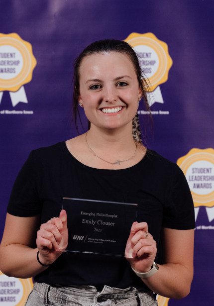 Emily Clouser holding her award.