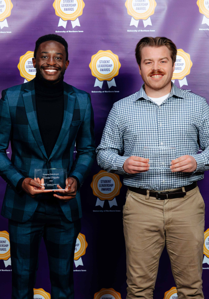 Tinashe Chigudu and Nathanial Madden holding their awards.