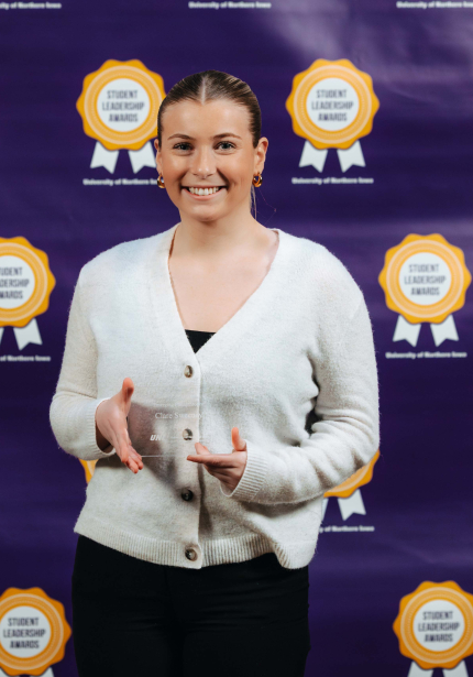 Clare Sweeney holding her award.