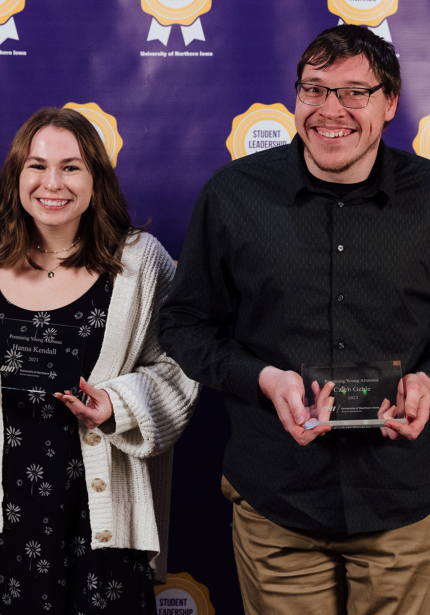 Caleb Gehle & Hanna Kendall holding their awards.