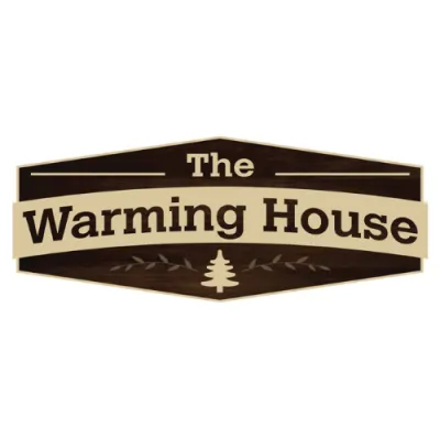 The Warming House logo with dark wood background, beige banner, and tree graphic