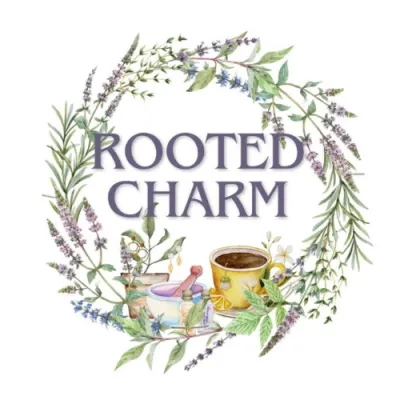 Rooted Charm logo with watercolor wreath of herbs 