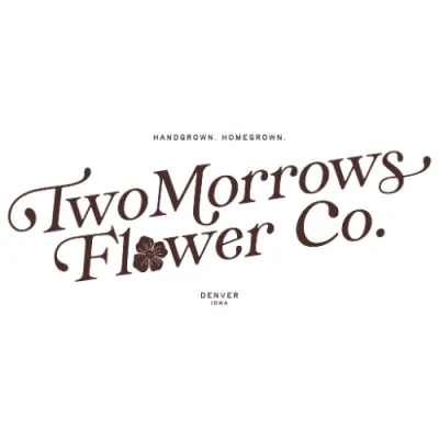 Logo for TwoMorrows Flower Co. featuring stylized brown script text with a small flower icon, the tagline “Handgrown. Homegrown.” above, and “Denver, Iowa” below.