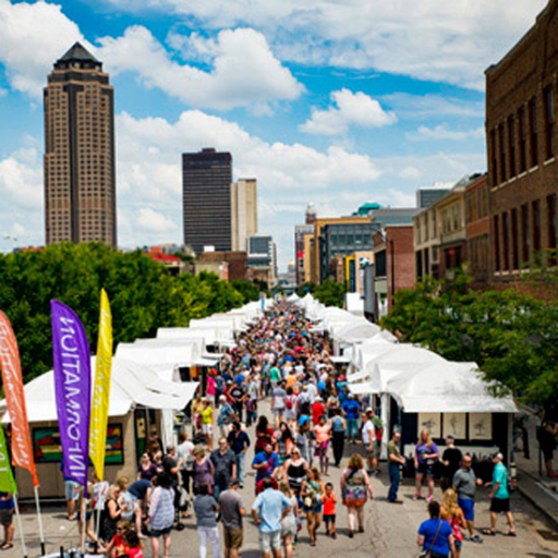Hundreds of people walking by booths at the Des Moines Art Festival
