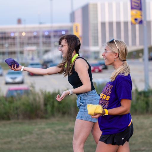 UNI students playing bags at UNI tailgate