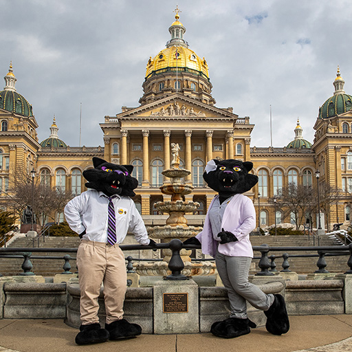 TC and TK in business attire in front of the Iowa Capitol