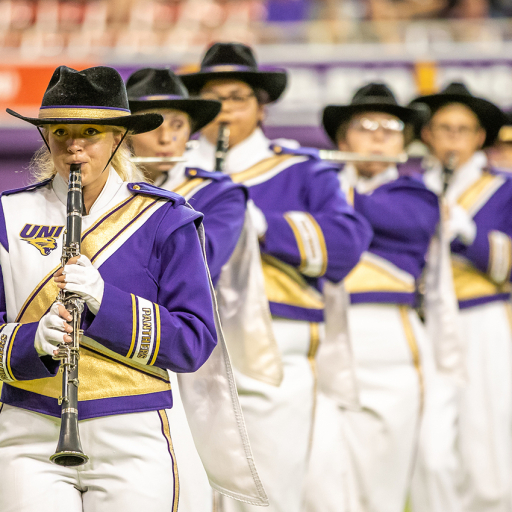 UNI Panther Marching Band students on field in UNI-Dome