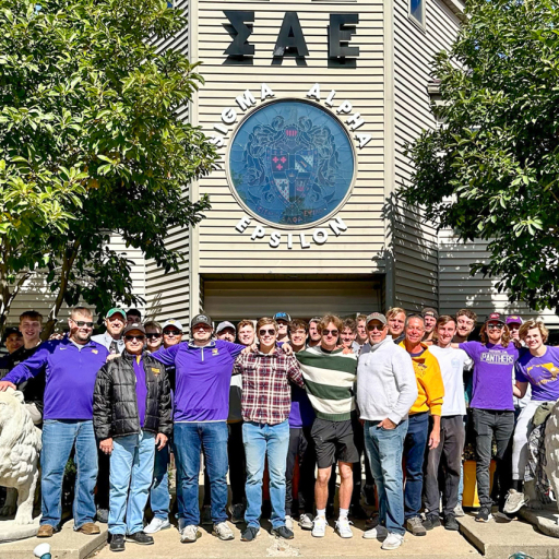 UNI SAE reunion 2023-SAE members in front of Sigma Alpha Epsilon house